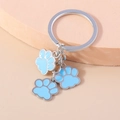 Creatieve metalen sleutelhanger met drie hemelblauwe emaille kattenpoot hangers - Blauw