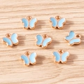 Detailed view of sky blue enamel butterfly charms with rose gold alloy plating for DIY crafts - 30 Pieces / Blue Butterfly (YD1841lanse)