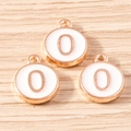 Detailed macro view of three rose gold number 0 alloy pendants with white enamel on wood - 10 Pieces Pack / White Number 0 (YD1814baise0)