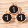 Detailed macro view of black enamel round charms with golden number one for DIY jewelry - 10 Pieces Pack / Black Number 1 (YD1814heise1)