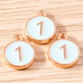 Detailed view of three light blue enamel number one charms with gold metal borders - 10 Pieces Pack / Blue Number 1 (YD1814lanse1)
