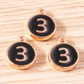 Detailed view of three circular black enamel number 3 pendants with gold alloy plating - 10 Pieces Pack / Black Number 3 (YD1814heise3)