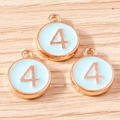 Detailed macro view of number 4 rose gold alloy charms with light blue enamel finish - 10 Pieces Pack / Blue Number 4 (YD1814lanse4)