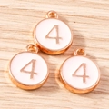 Macro shot of three rose gold number 4 charms with white enamel for DIY jewelry making - 10 Pieces Pack / Pink Number 4 (YD1814fense4)