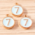 Close-up of number 7 alloy pendants in rose gold finish with light blue enamel detail - 10 Pieces Pack / Blue Number 7 (YD1814lanse7)