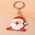 Simpatico portachiavi di Babbo Natale in acrilico con anello argento su sfondo caldo - Babbo Natale