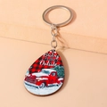 Detail of wooden Christmas keychain with vintage red truck and festive text on beige background - Red Truck Style (YZ819)