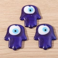 Three blue glass Hamsa Evil Eye charms on wood background for DIY jewelry making - Hamsa Hand Style (YQ651) / 5 Pieces