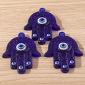Three deep blue resin Hamsa Hand pendants with Evil Eye and intricate floral motifs - Large Hamsa Hand Style (YQ652) / 5 Pieces