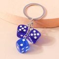 Creative keychain featuring three blue and purple transparent acrylic dice pendants - Blue