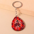 Dettaglio del portachiavi natalizio in legno a goccia con fiocco rosso e bastoncino di zucchero - Stile Bastoncino di Zucchero (YZ826)