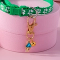 Green pet collar with white paw prints, fishbone pendant and golden bell on pink stand - Green Paw Print Collar Blue Pendant / Blue
