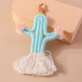 Handmade mint green knitted cactus keychain with pink pom-poms and white cotton tassel - Blue