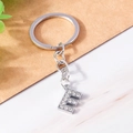 Sparkling silver keychain with rhinestone-encrusted letter E on a minimalist background - Letter E(YZ408E)
