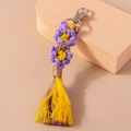 Portachiavi a fiore intrecciato a mano con nappe viola e gialle e chiusura a moschettone - Viola