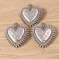 Retro matte silver heart pendants with crown detail and sunburst texture on wood background - Crown Sacred Heart Style (YJ1025)