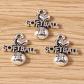 Macro detail of antique silver I Love Softball heart pendants on a wood surface - Softball / 10 Pieces Pack