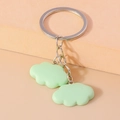Detailed close-up of mint green resin cloud charms with silver keychain metal link chain - Green