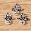 Close-up of three vintage silver I Love Soccer charms with 3D football on wood - Soccer Type 1 / 10 Pieces Pack
