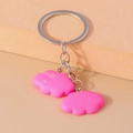 Detail view of pink resin cloud charms on a silver metal keychain with a soft matte finish - Rose Red