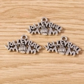 Detailed macro of vintage silver volleyball mom charms on a rustic wooden surface - Volleyball Mom / 10 Pieces Pack
