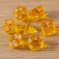 Macro detail of translucent amber polyhedral dice set on natural wood background - 7-Pack Set / Orange