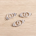 Three pieces of antique silver alloy handcuffs charms with Freedom engraving for DIY jewelry - 10 Pieces Pack / Silver