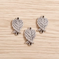 Detailed view of three antique silver angel wing alloy charms with double loops for DIY - Antique Silver