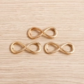 Three gold infinity symbol charms made of polished alloy for DIY jewelry making and crafts - 20 Pieces Set / Gold