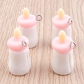 Detail view of miniature resin milk bottle pendants for DIY crafts and keychains - 10 Pieces Pack / White
