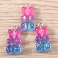 Detailed macro view of three gradient resin gummy bear charms with glitter for DIY jewelry - 10 Pieces Pack / Blue Pink