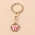Portachiavi a farfalla in acrilico rosa con strass scintillanti e finitura oro - Rosa