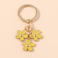 Porte-clés en métal doré avec trois breloques de fleurs en émail jaune pour sacs et téléphones - Jaune