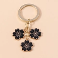 Minimalistischer Kirschblüten Schlüsselanhänger mit goldenem Metall und schwarzer Emaille - Schwarz