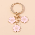 Porte-clés fleurs de cerisier roses avec anneau en métal doré et breloques de fleurs - Rose