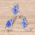 Detailed close-up of blue enamel koi fish pendants with silver metal outlines - 10 Pieces Pack / Silver