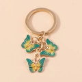 Golden butterfly keychain pendant with green and yellow gradient enamel drops - Green