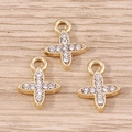 Macro detail of three gold-plated cross pendants with inlaid rhinestones and top loops - 10 Pieces/Pack / Gold Rhinestone Style (YD1472jinse)