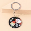 Detail of Christmas keychain with Santa Claus and elf motif on black acrylic disc - Black Santa Claus