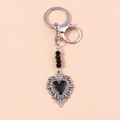 Detail of gothic silver metal keychain featuring hollow heart pendant and black beads - Black Hollow Heart (YZ202heise)