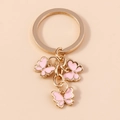 Portachiavi con farfalle in smalto rosa e finiture dorate con pendenti multipli - Rosa (YZ174fense)
