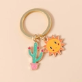 Llavero dorado con lindos colgantes de cactus y sol sonriente en estilo de dibujo animado - Cactus Rosa Sol Sonriente (YZ164xianrenzhang)