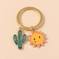 Llavero dorado con colgantes de cactus verde y sol naranja para decorar bolsos - Cactus Verde Sol (YZ164lvse)