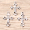 Macro view of three silver alloy cross pendants with sparkling white zircon inlays - Silver Vintage Hollow Cross (YD1488) / 10 Pieces Pack