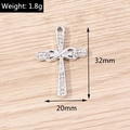 Detailed macro view of silver alloy infinity cross pendant with sparkling rhinestones - Silver Infinity Cross (YD1491) / 10 Pieces Pack