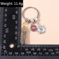 Colorful hexagonal pillar keychain with wire-wrapped stone, sun charm, and red gem - Sun Face Colorful Stone (YZ195)