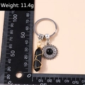 Black hexagonal crystal pillar keychain with golden wire wrap and silver sun pendant - Sun Face Black Stone (YZ196)