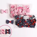 Set of 40 kids bow hair clips featuring pink and navy blue star patterns on white display cards - 40Pcs Pack / Pink And Blue Stars (MS2276)
