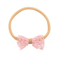 Bandeau bébé avec nœud en dentelle rose et centre doré brillant sur nylon beige - Nœud de Ligne (MB1525)