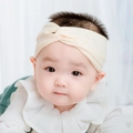 Sweet cream beige knitted twist headband for infants with elastic ribbed texture - Creamy Yellow